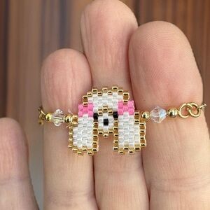 Hand crafted beaded mini poodle dog face adjustable slider bracelet gold color